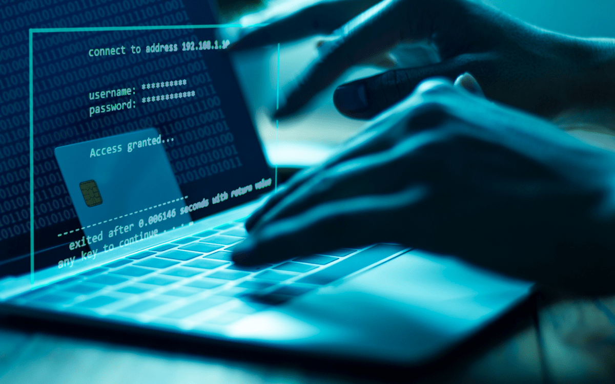 Person accessing an online account on a laptop