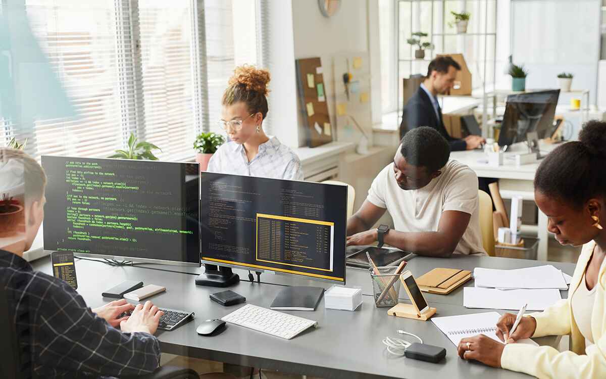 Programmers working at office of IT company