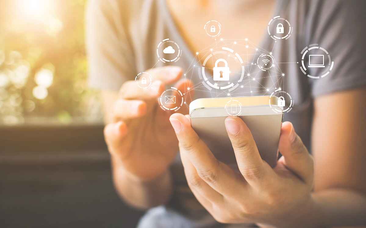 Woman using smartphone with icon graphic cyber security network of connected devices and personal data information
