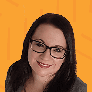 Woman wearing glasses smiling at camera
