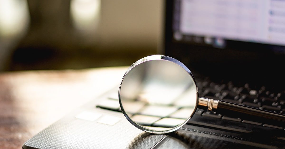 A magnifying glass looking into web scraping