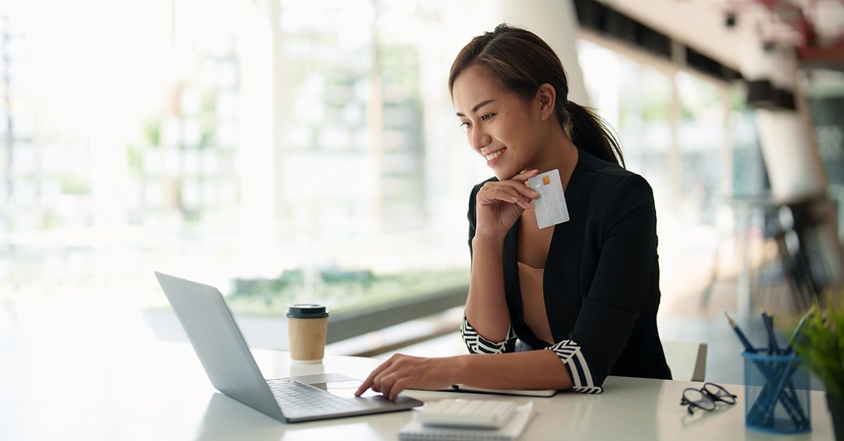 A woman happy to have a secure account and not a stolen credit card