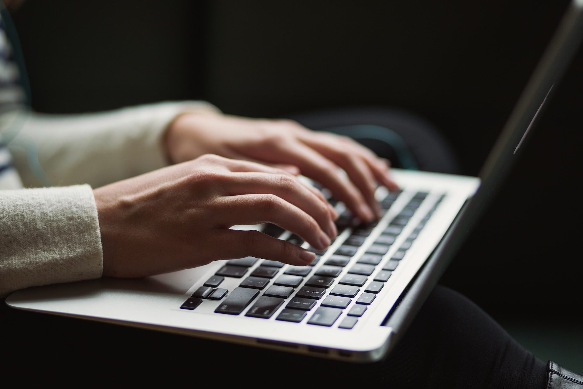Female typing on computer
