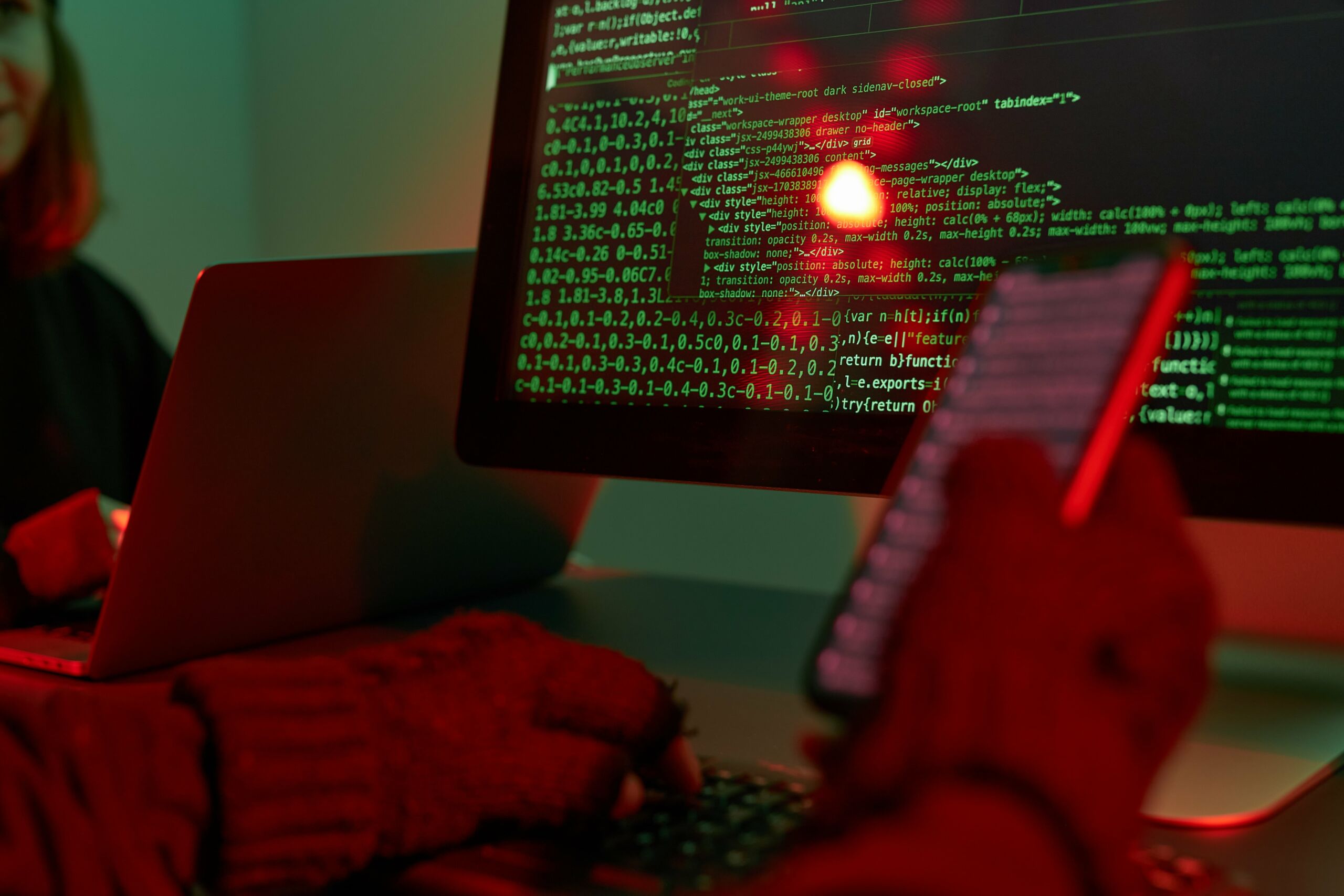 hacker with gloves typing code 