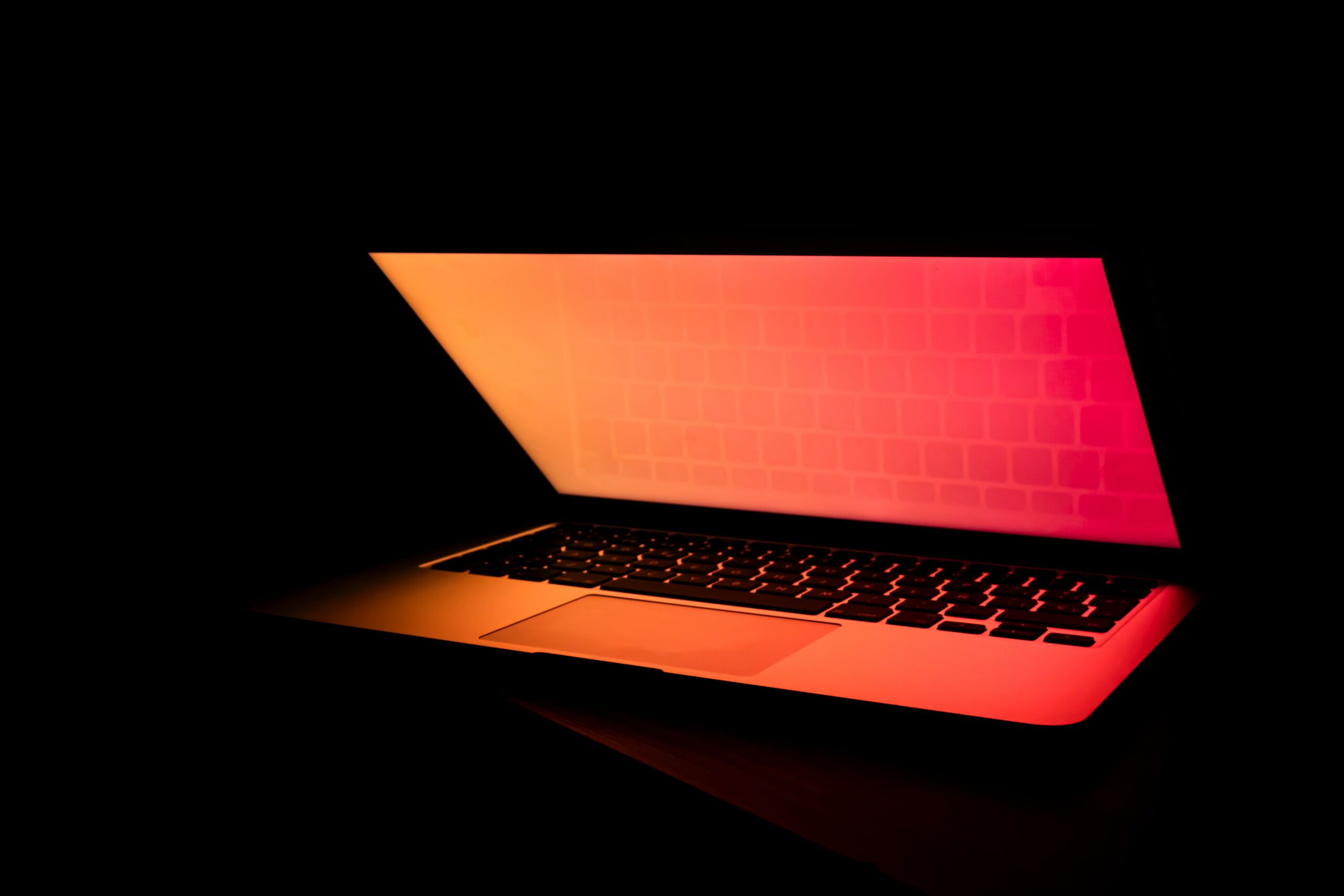 red illuminated laptop screen