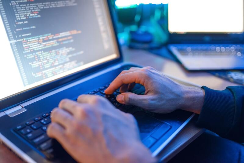 person typing on laptop computer 