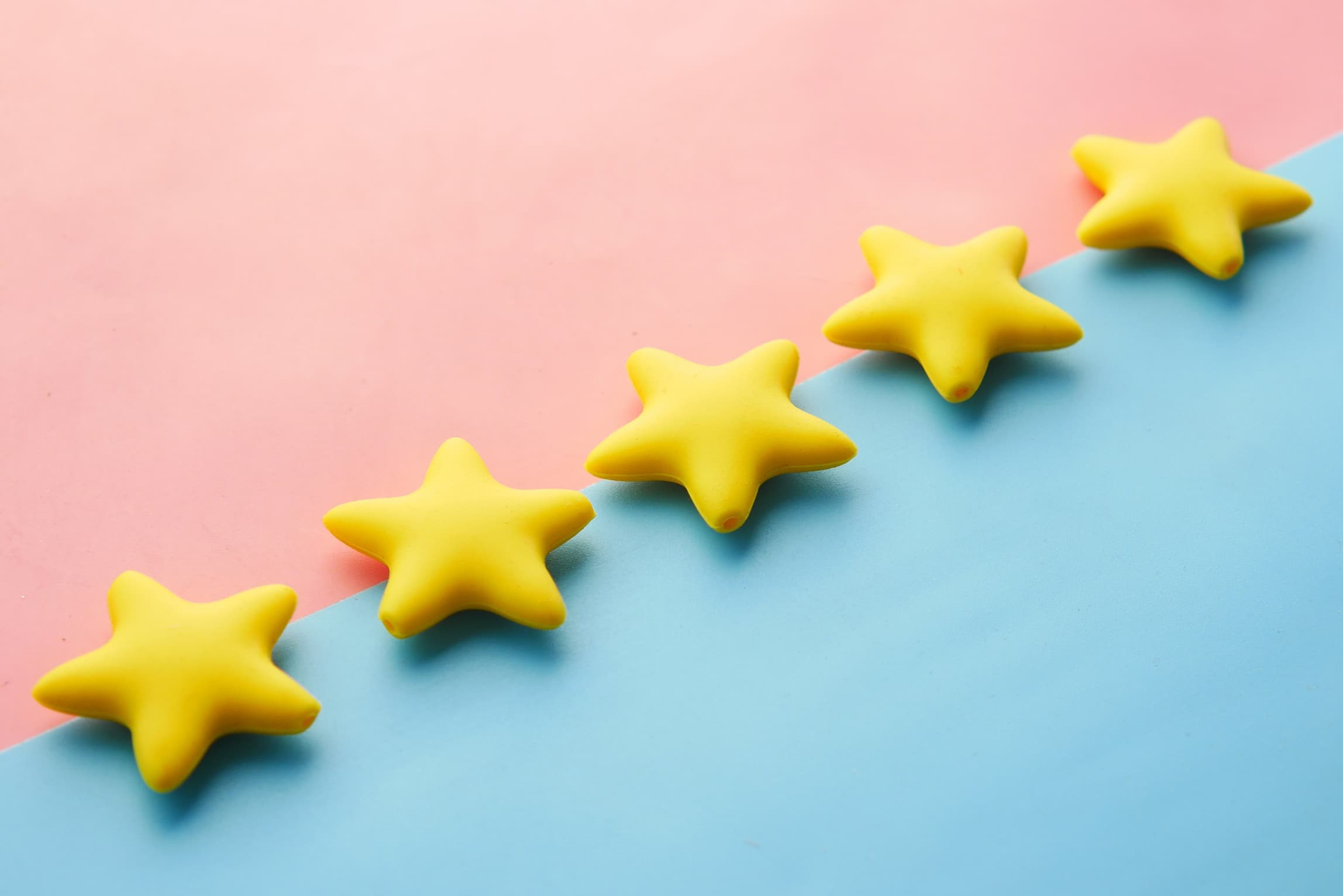 five stars on pink and blue background