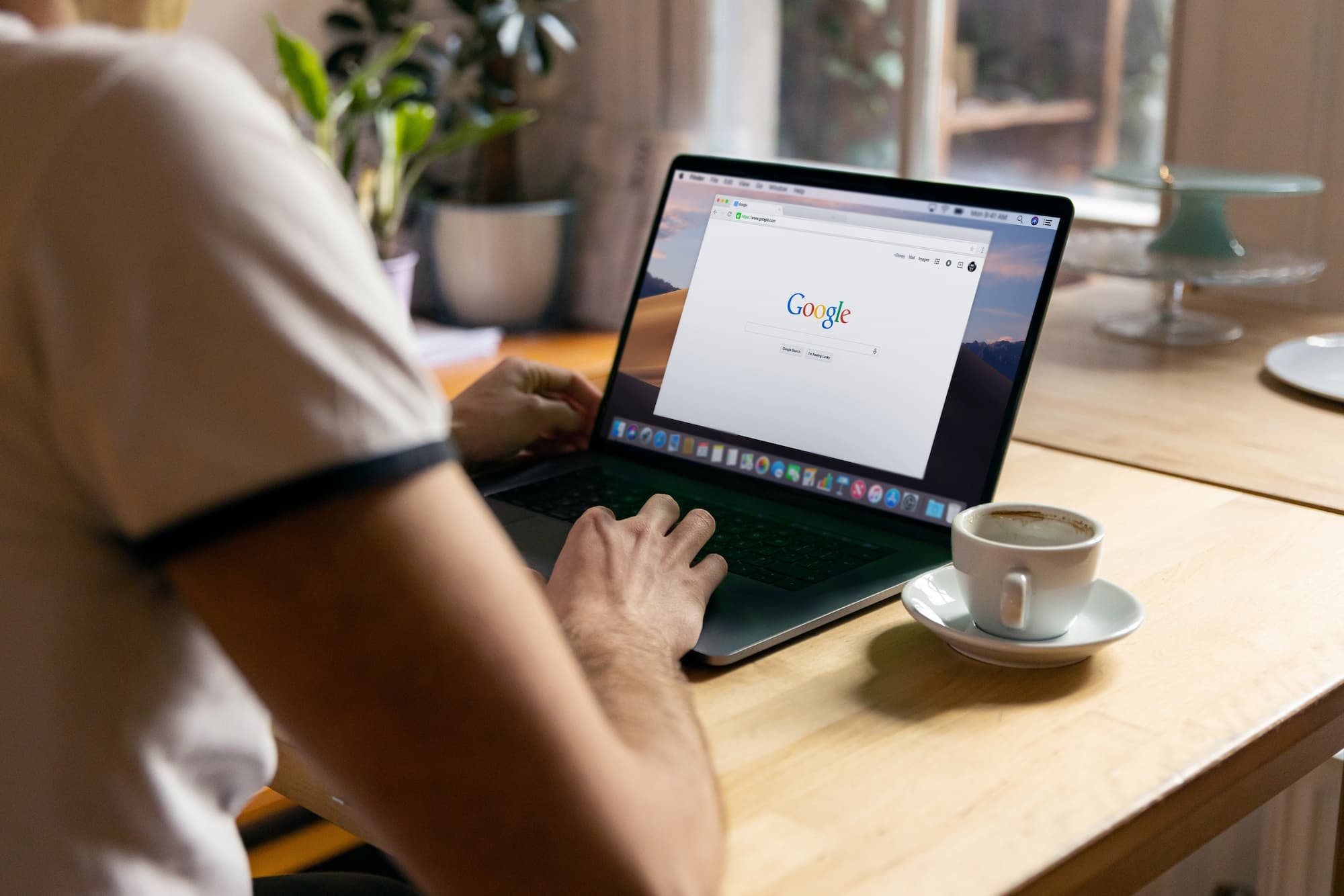 person logging into google on laptop 