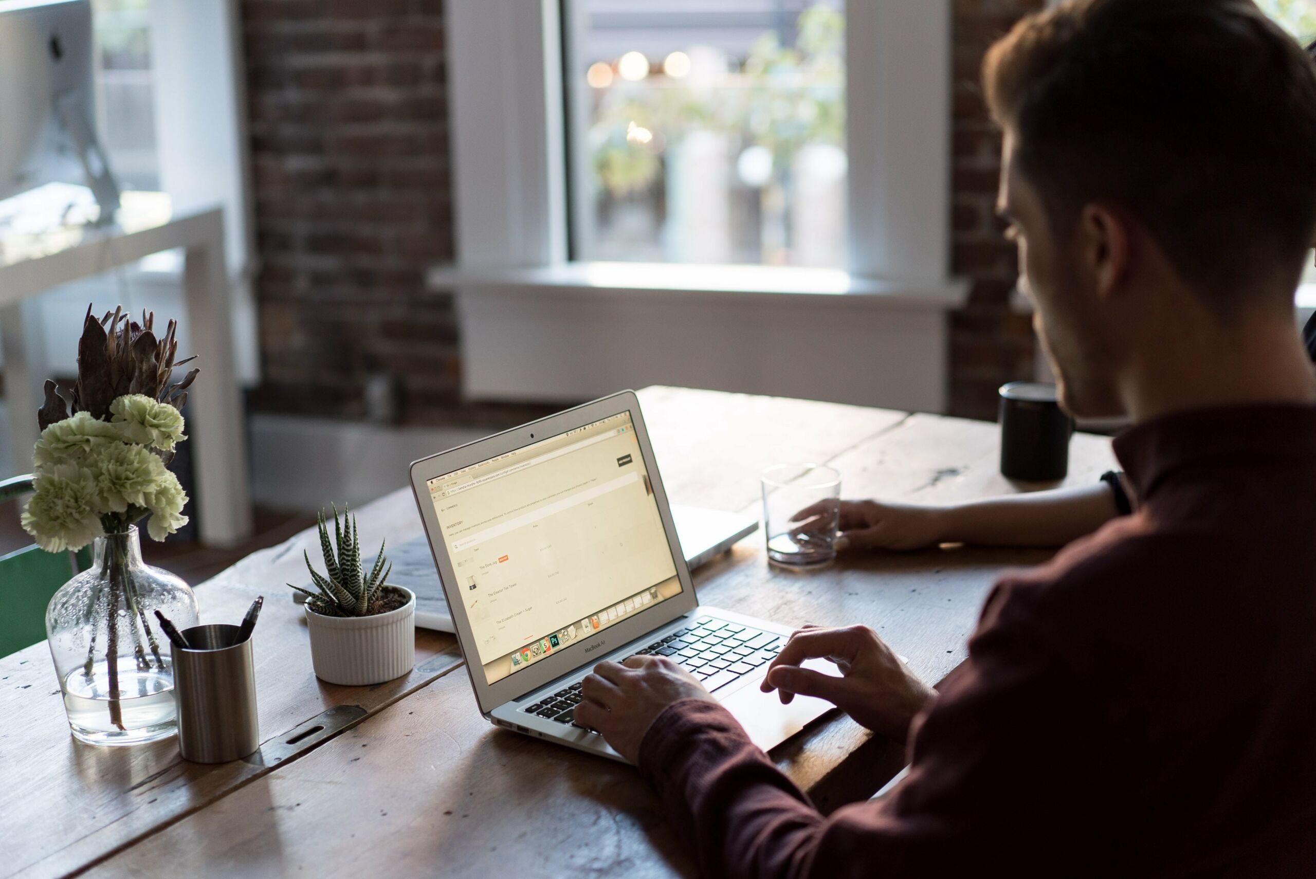 person on laptop at table